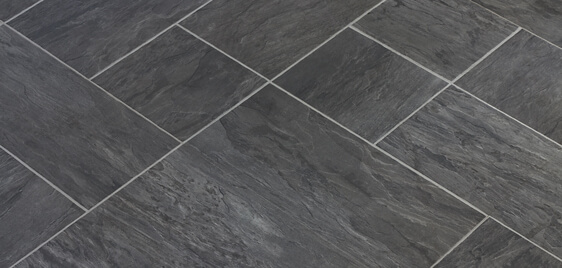 Closeup of dark textured tile floor